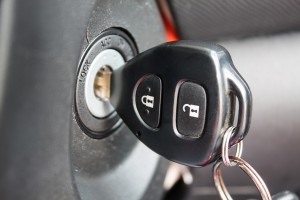 car key inserted into the lock of ignition of the car
